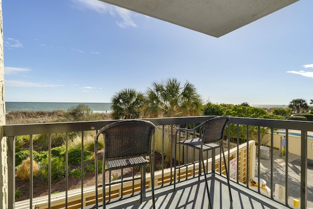 balcony featuring a water view