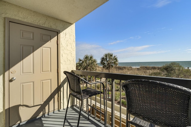 balcony featuring a water view