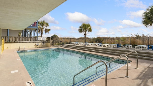 view of swimming pool featuring a patio