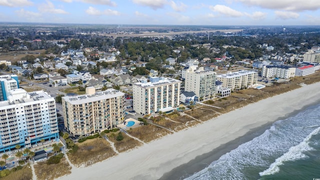 aerial view with a water view and a view of the beach