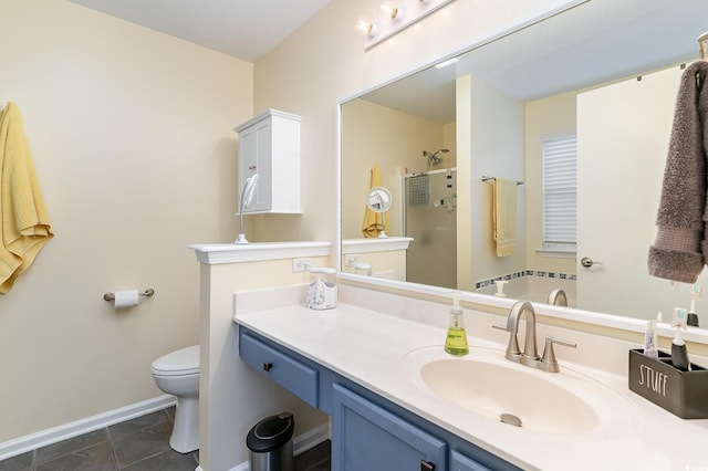 bathroom featuring vanity, an enclosed shower, and toilet