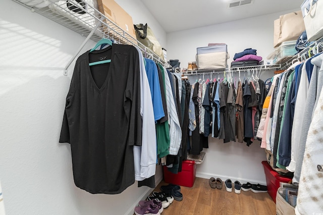 spacious closet featuring hardwood / wood-style floors