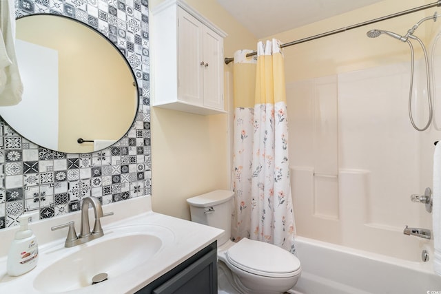 full bathroom featuring shower / tub combo, vanity, and toilet