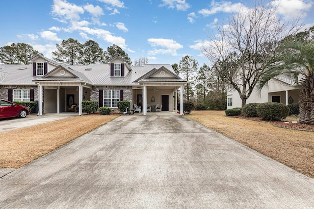 view of front facade with a front lawn and a carport