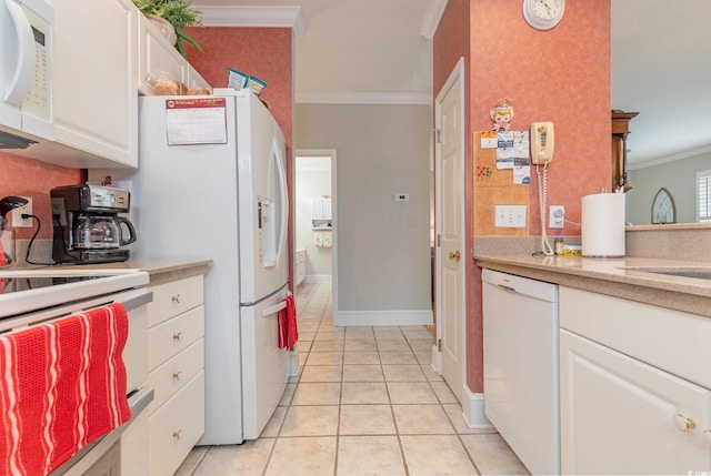 kitchen featuring white cabinets, light tile patterned flooring, white appliances, and crown molding