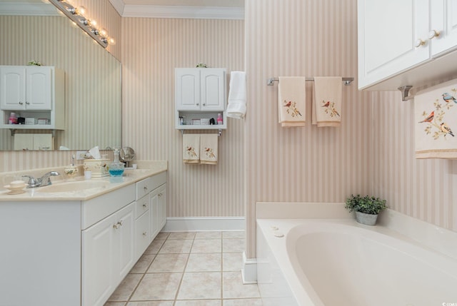 bathroom featuring tile patterned flooring, vanity, ornamental molding, and a bath