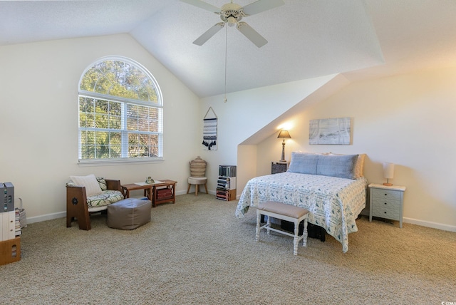 carpeted bedroom featuring vaulted ceiling and ceiling fan