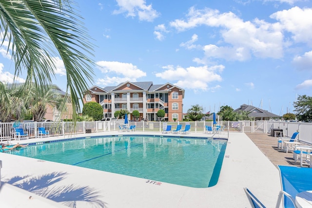 view of swimming pool with a patio area