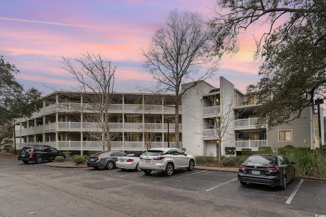 view of outdoor building at dusk