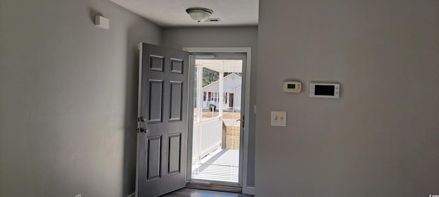 foyer entrance with visible vents