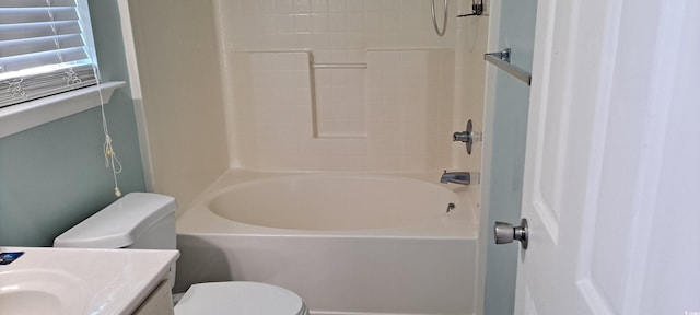 bathroom with toilet, vanity, and bathing tub / shower combination