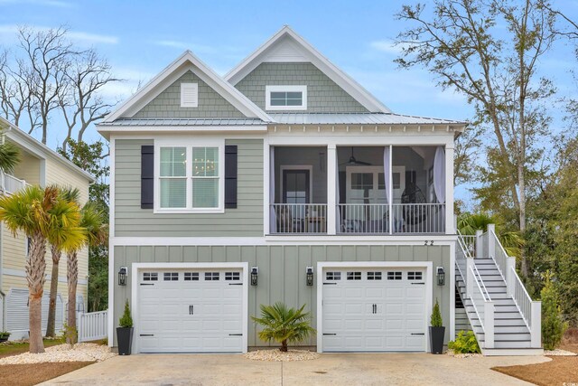 view of front of home featuring a sunroom and a garage