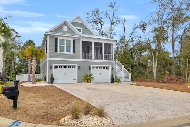 view of front of house featuring a sunroom and a garage