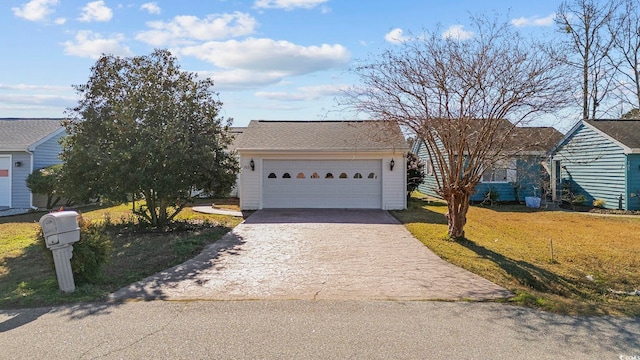 ranch-style house featuring a front yard and a garage