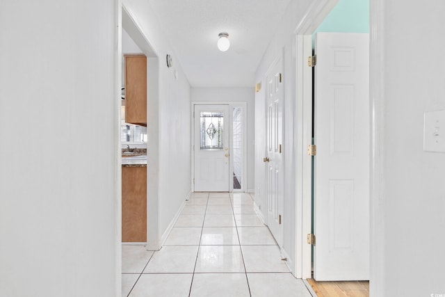 703 Gleneagles Dr, Myrtle Beach, SC 29588 - hall with light tile patterned floors and a textured ceiling