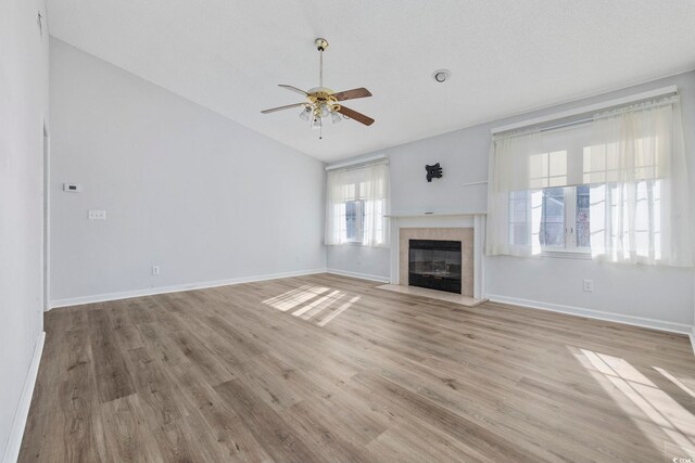 703 Gleneagles Dr, Myrtle Beach, SC 29588 - unfurnished living room with lofted ceiling, ceiling fan, and light wood-type flooring