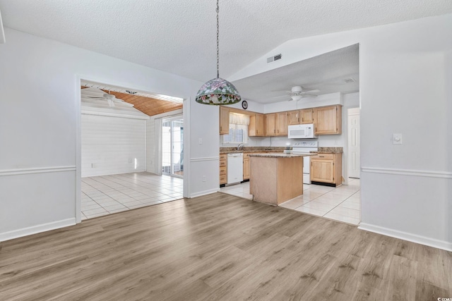 703 Gleneagles Dr, Myrtle Beach, SC 29588 - kitchen featuring a center island, light brown cabinets, white appliances, hanging light fixtures, and vaulted ceiling