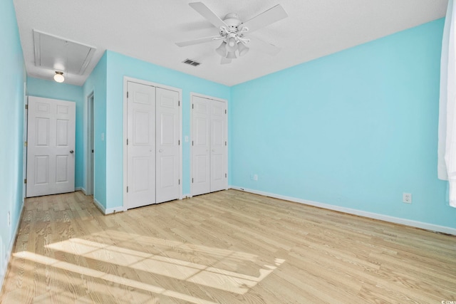 703 Gleneagles Dr, Myrtle Beach, SC 29588 - unfurnished bedroom featuring ceiling fan, two closets, and light wood-type flooring
