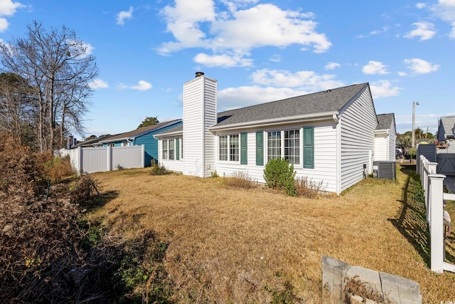 703 Gleneagles Dr, Myrtle Beach, SC 29588 - back of property with a yard and central AC