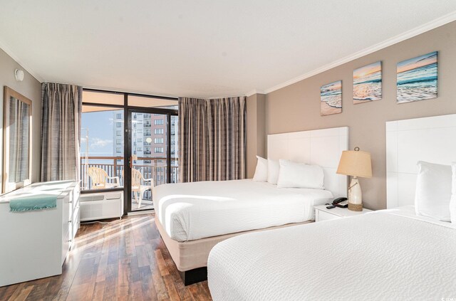 bedroom with dark hardwood / wood-style flooring and ornamental molding