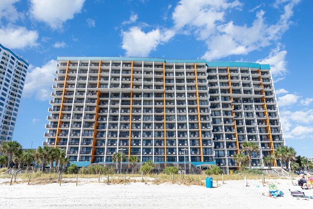 property view of water featuring a beach view