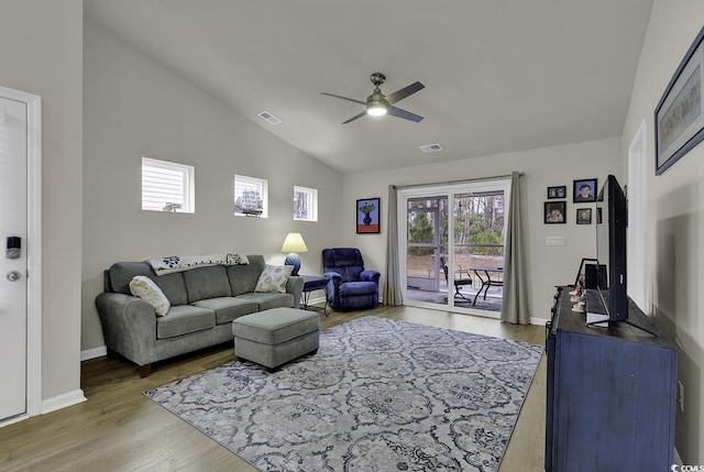 living room featuring ceiling fan, vaulted ceiling, and hardwood / wood-style flooring