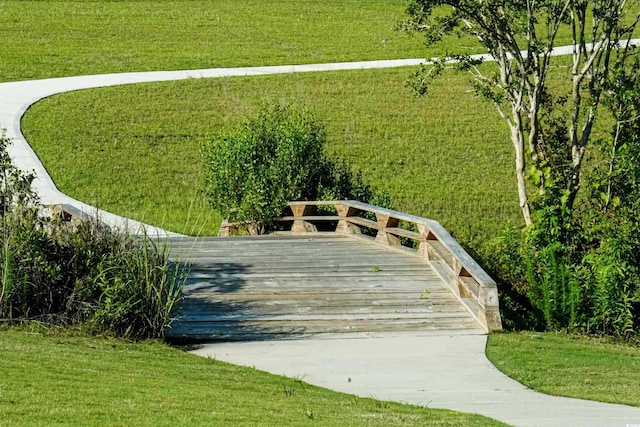 view of home's community featuring a lawn