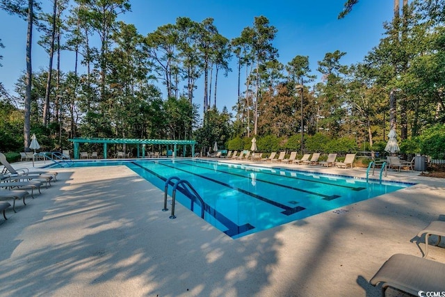 view of swimming pool featuring a patio area