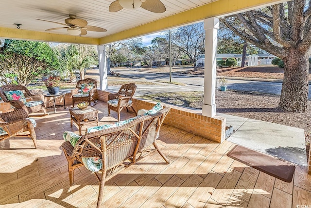 view of patio / terrace with ceiling fan and an outdoor living space