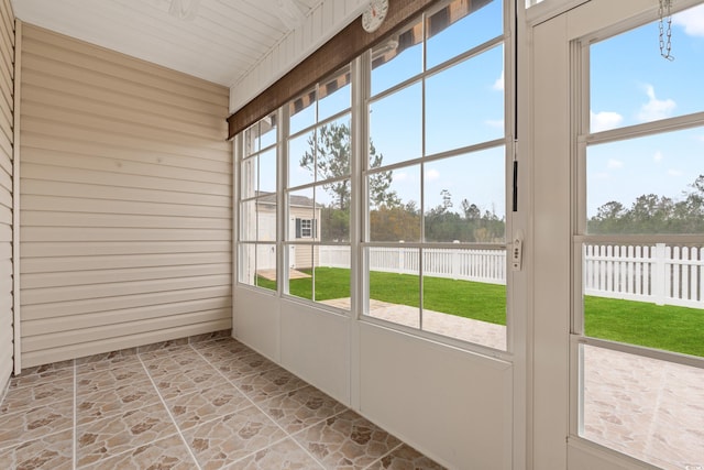 unfurnished sunroom with plenty of natural light