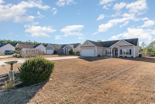 ranch-style home featuring a garage, concrete driveway, a front yard, and a residential view