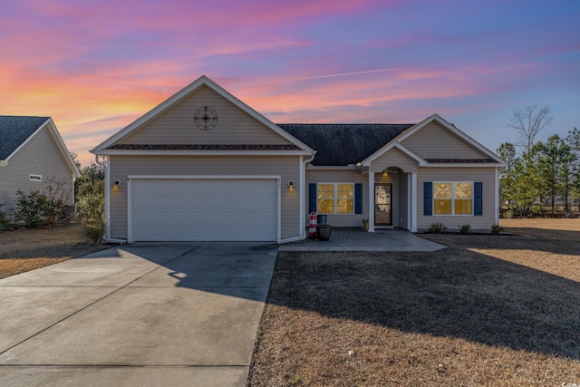 ranch-style home with a garage and concrete driveway