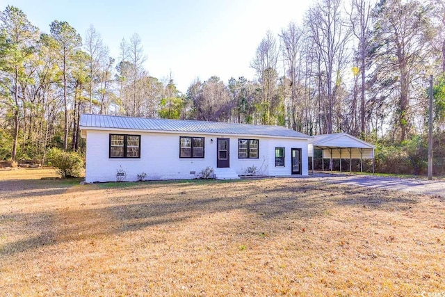 single story home featuring a carport and a front yard