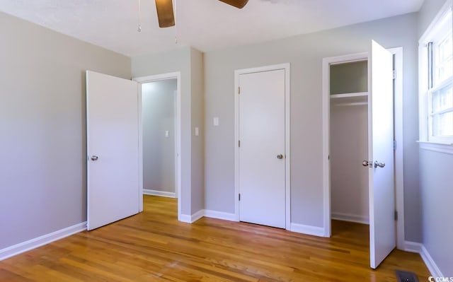 unfurnished bedroom with ceiling fan and light hardwood / wood-style flooring