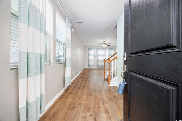 hall with light wood-type flooring