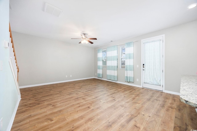 unfurnished room with ceiling fan and light hardwood / wood-style flooring