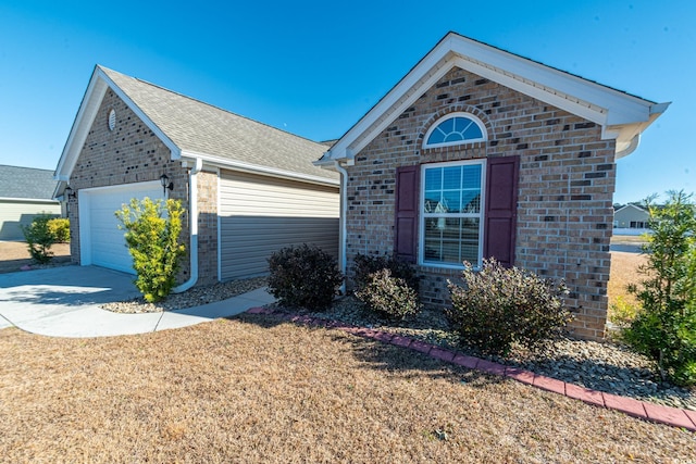 view of front facade with a front yard and a garage