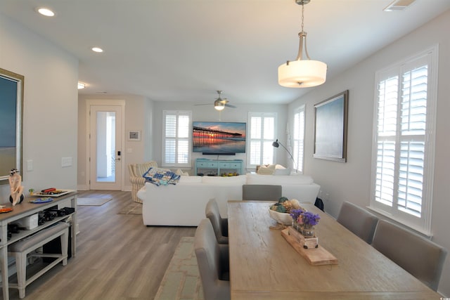 dining room featuring ceiling fan and light wood-type flooring