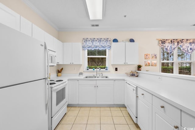 kitchen featuring white cabinetry, sink, white appliances, light tile patterned flooring, and ornamental molding