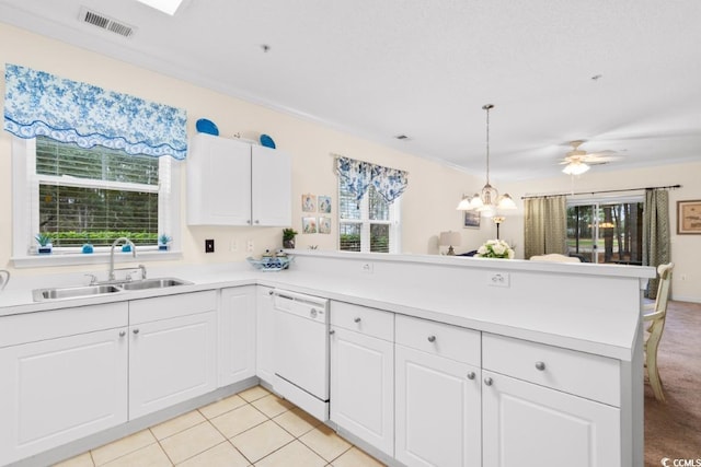 kitchen featuring white dishwasher, white cabinetry, kitchen peninsula, and light tile patterned floors