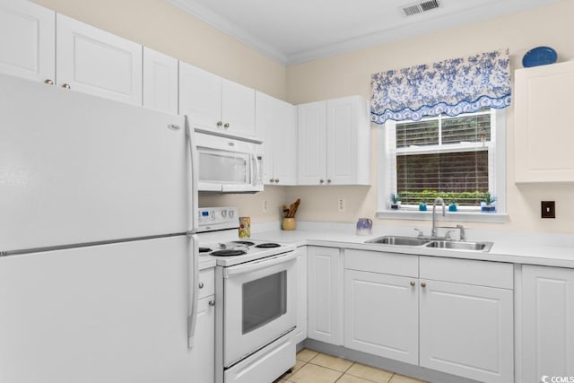 kitchen with white appliances, crown molding, sink, light tile patterned floors, and white cabinetry