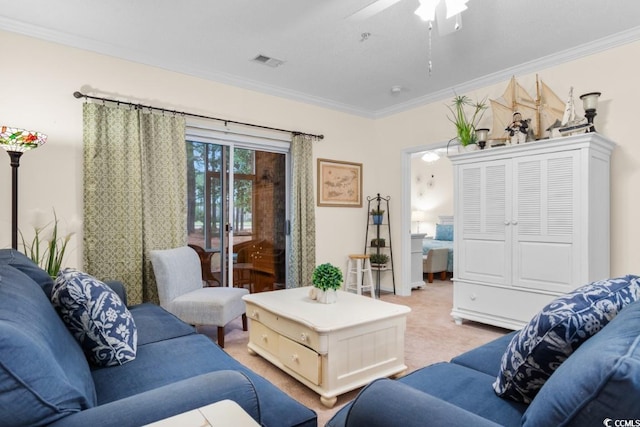 living room featuring ceiling fan, light carpet, and ornamental molding