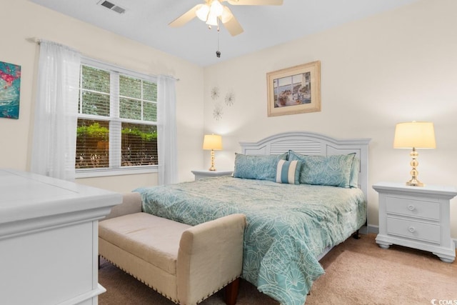 bedroom with light colored carpet and ceiling fan