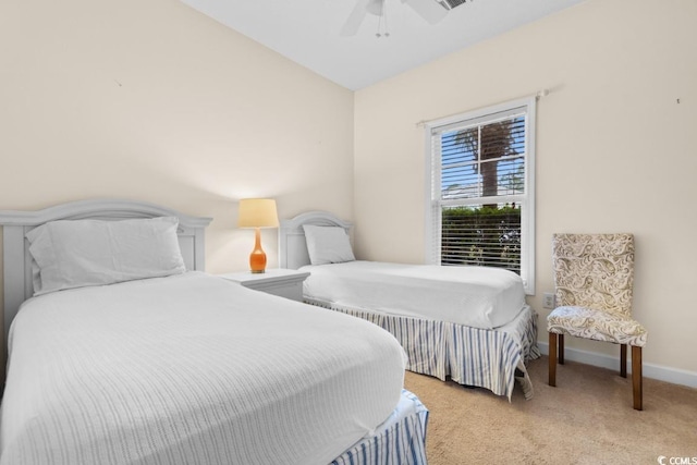 bedroom featuring ceiling fan, light colored carpet, and vaulted ceiling