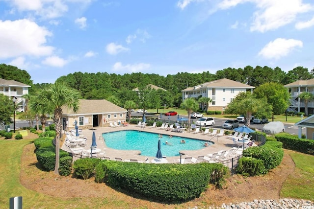 view of swimming pool featuring a patio area