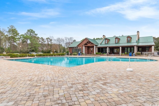 view of pool featuring a patio area