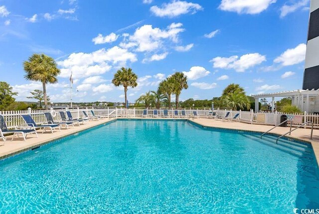4672 Lightkeepers Way Unit 50-E, Little River, SC 29566 - pool featuring a pergola, fence, and a patio