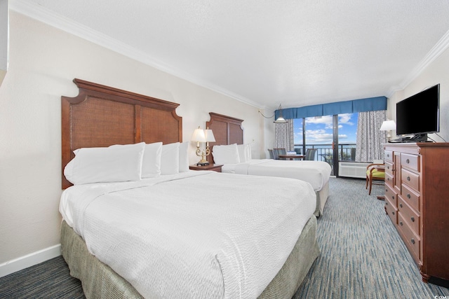 bedroom featuring ornamental molding, access to exterior, and a textured ceiling