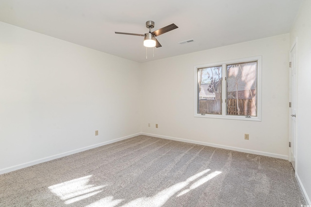 empty room featuring carpet and ceiling fan