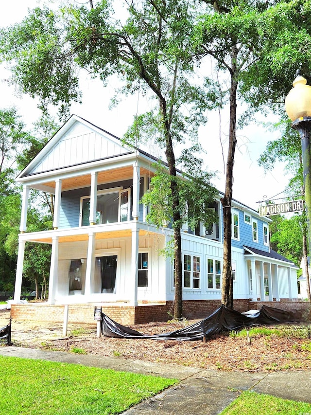 239 Madison Dr, Georgetown, SC 29440 - view of front of property featuring board and batten siding and a porch